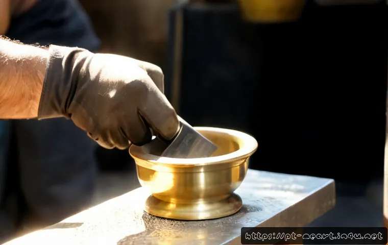 Home 17 금속공예 작품 제작 과정 - Photorealistic close-up of a Portuguese metal artisan shaping a small brass bowl with a polished cha...